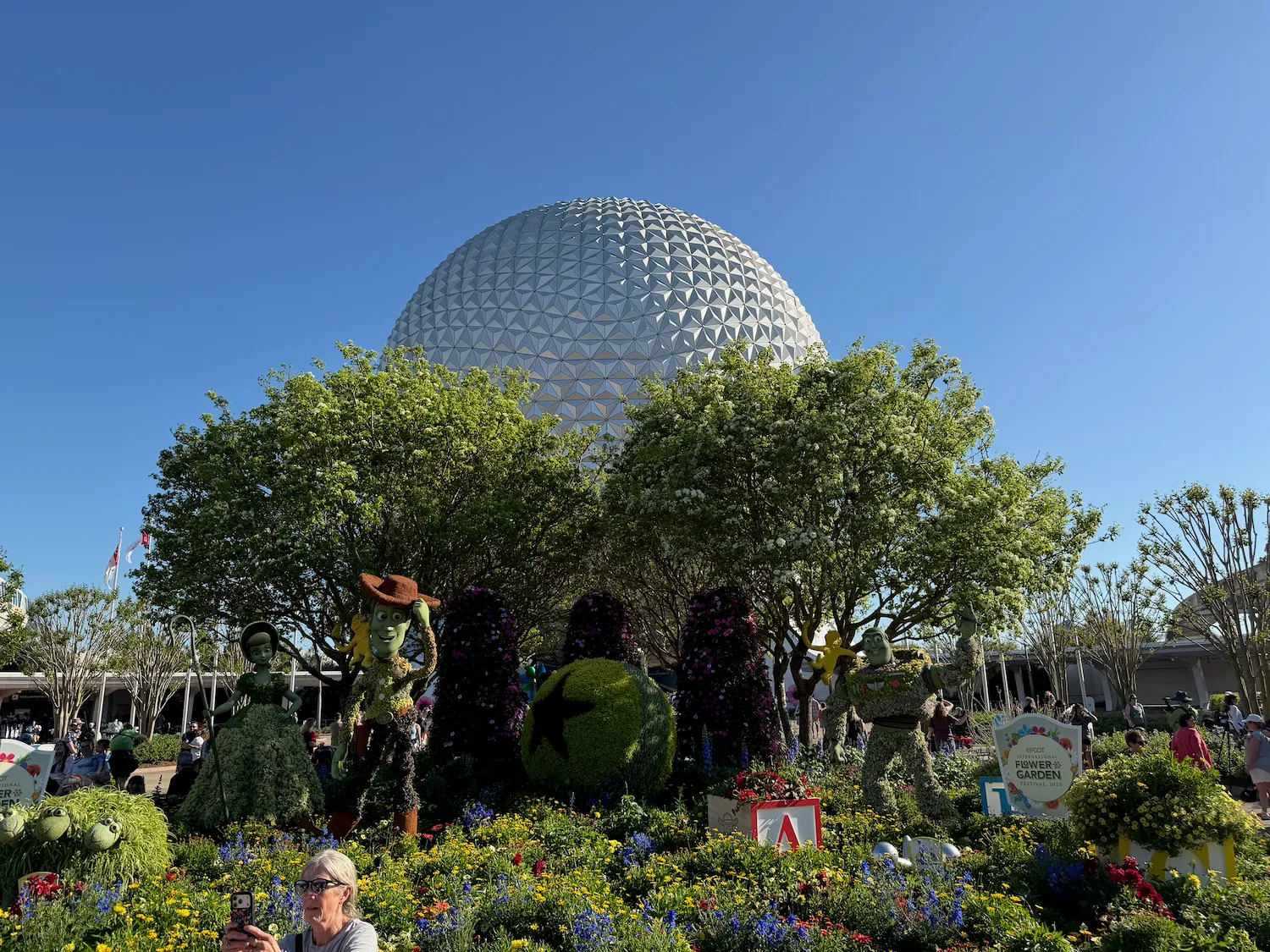 Flower and Garden Festival 2026 Woody, Buzz, Bo Peep, and Spaceship Earth