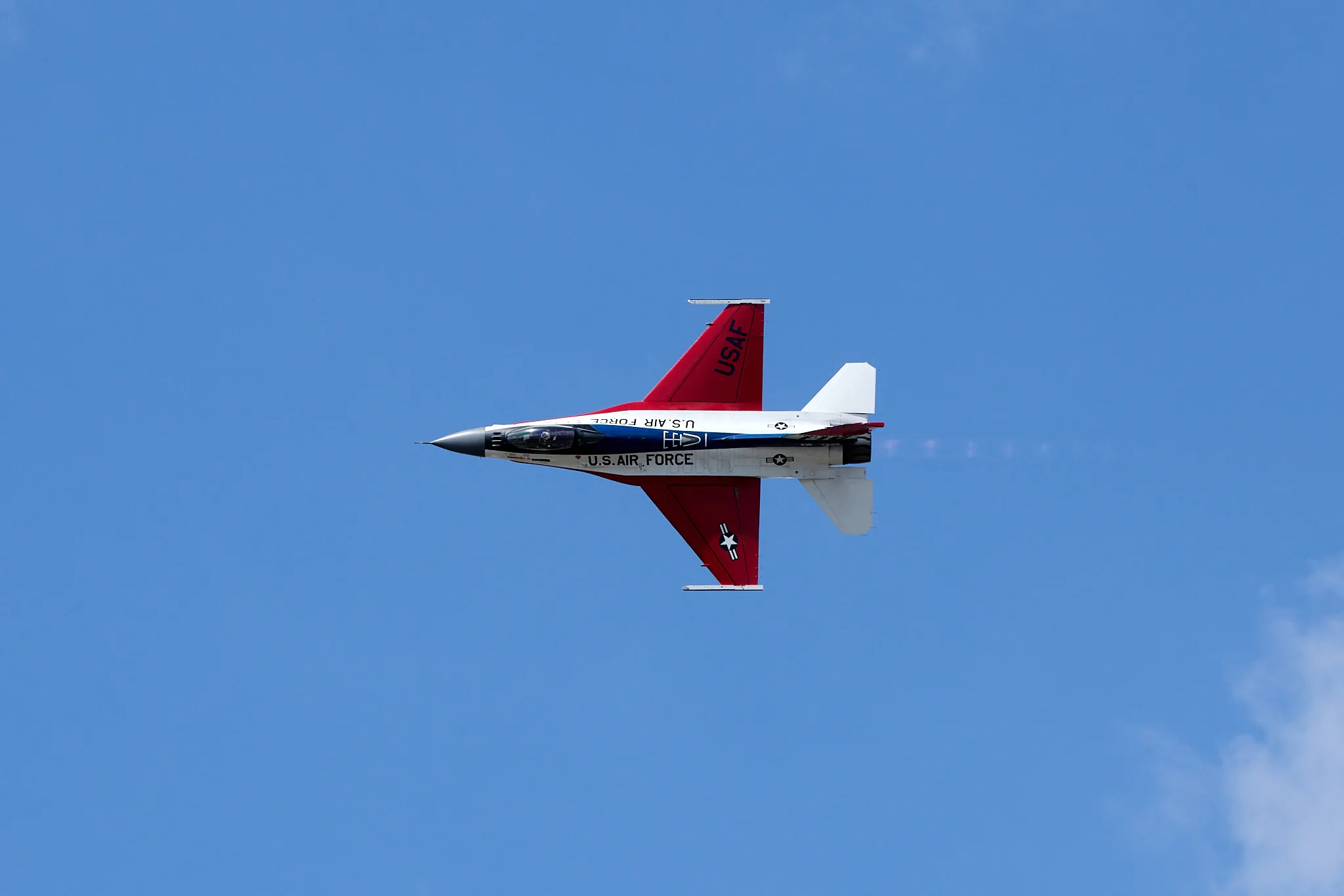 F16 Falcon with a slight jet trail